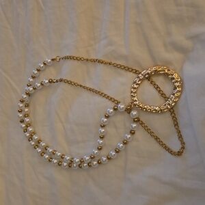 Pearl and gold tone necklace. Hangs down 19 inches,and chain length is 34 inches